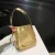 Gold shoulder bag