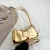 Golden shoulder bag